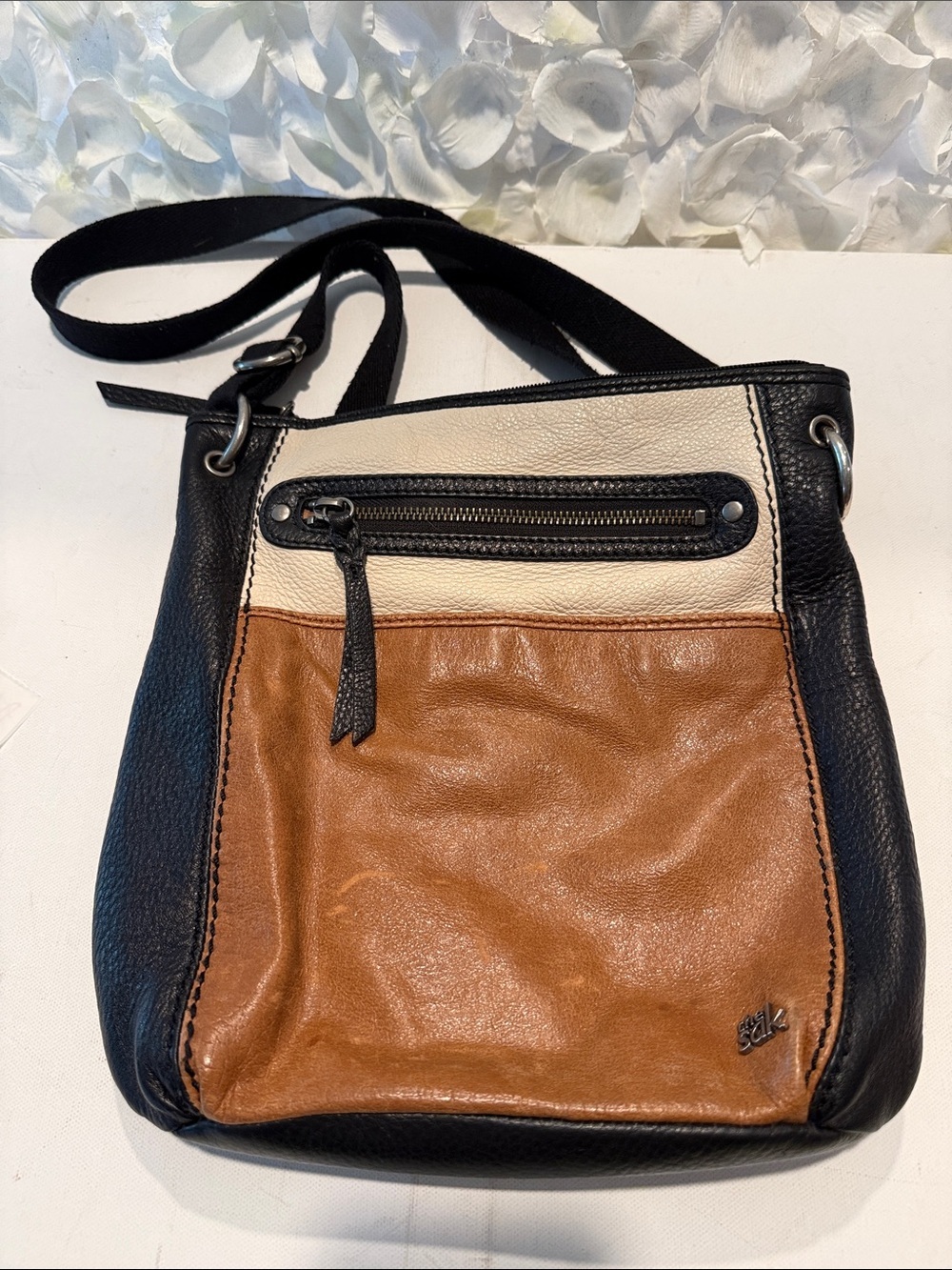 The Sak Leather Crossbody Bag in Black, Cream, and Brown